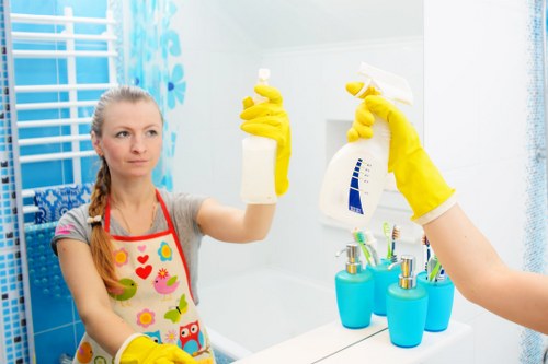 Cleaner wearing protective gloves while preparing safe cleaning materials
