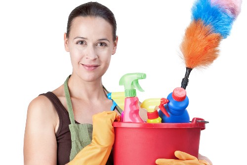 Cleaning dust and debris after renovation work in a Merton property