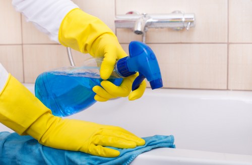 Local cleaner carrying out routine cleaning in Merton
