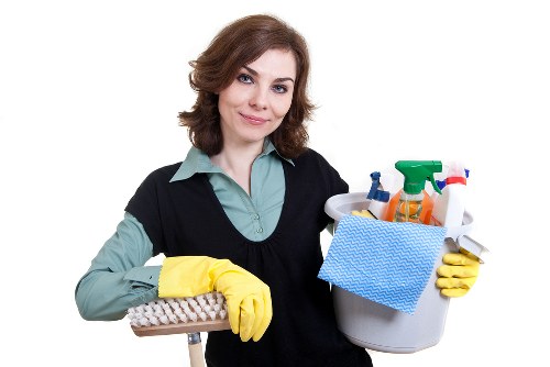 Cleaner working in a modern Merton kitchen
